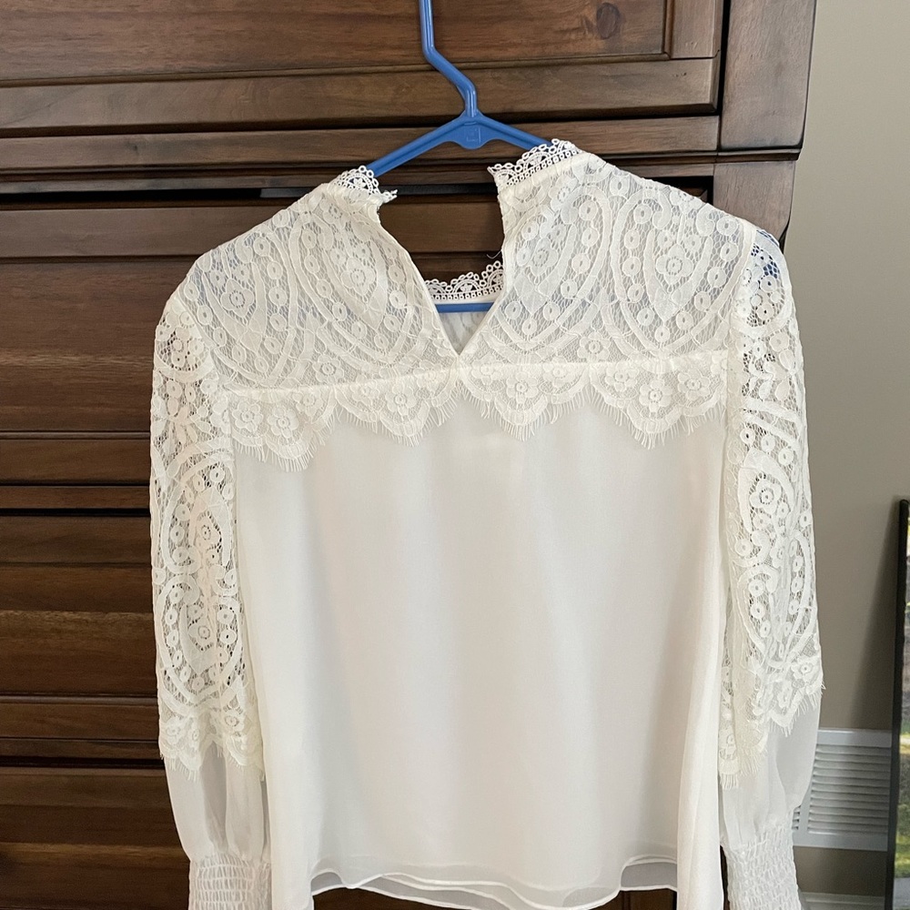 White Sheet and Lace Blouse